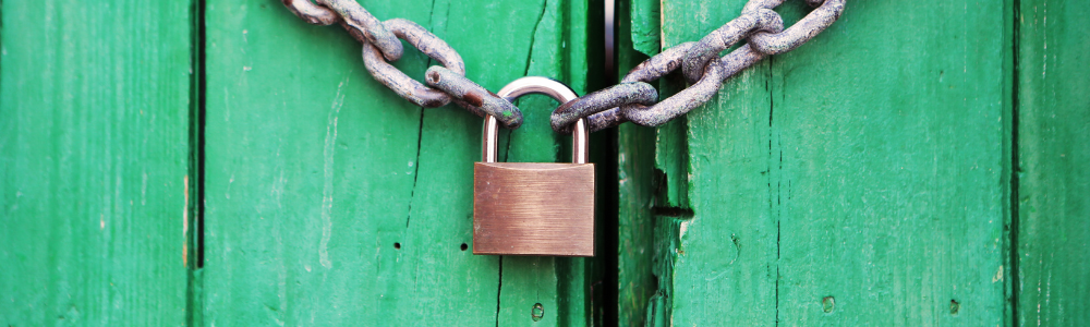 brass coloured metal padlock with chain