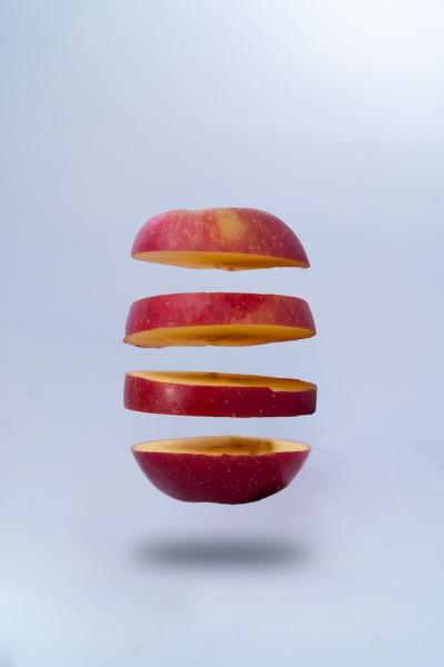 Sliced apple on grey background