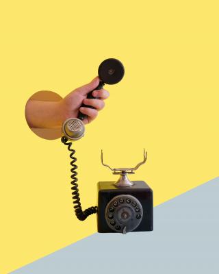 Hand offering telephone