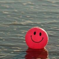 smiley-face ball in water