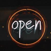 Neon sign that says open