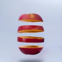 Sliced apple on grey background