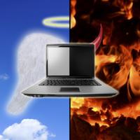 Laptop with half heaven and half hell background